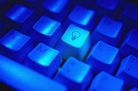 A glowing blue keyboard, with a lightbulb marked on one key.